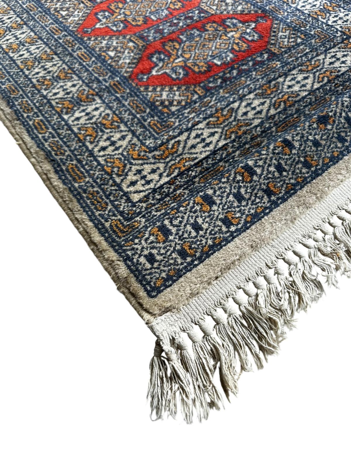 Tapis oriental 130cm x 60cm